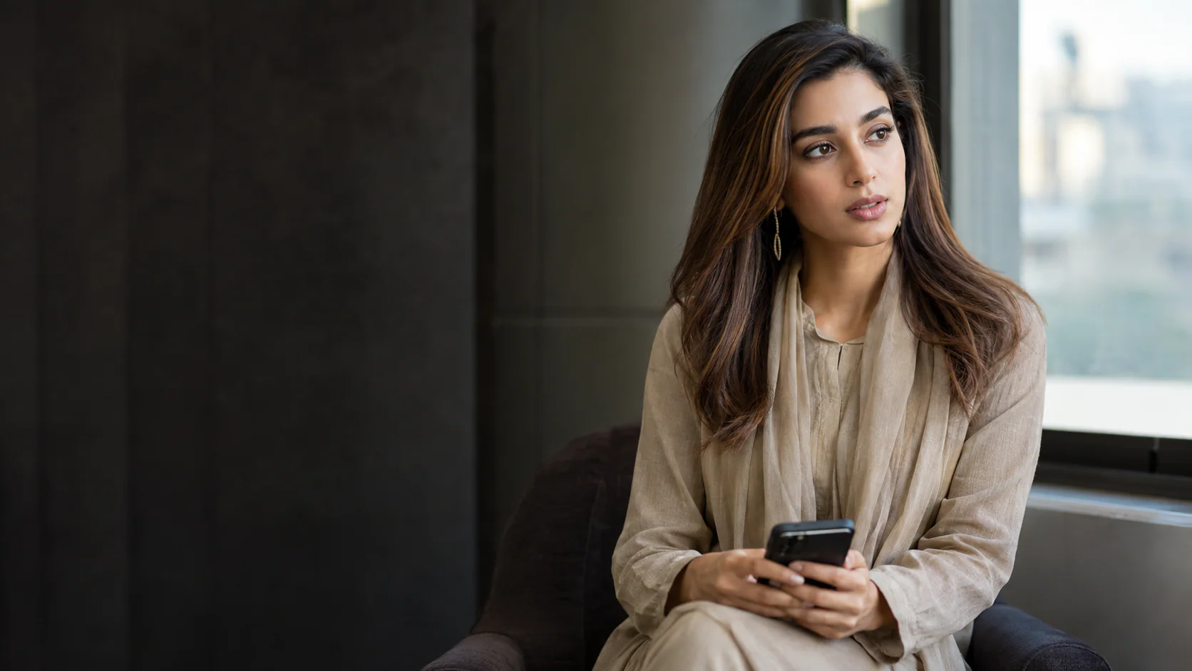Iqra Aziz in a sober editorial portrait illustrating her public call for stronger child protection and accountability in Pakistan.